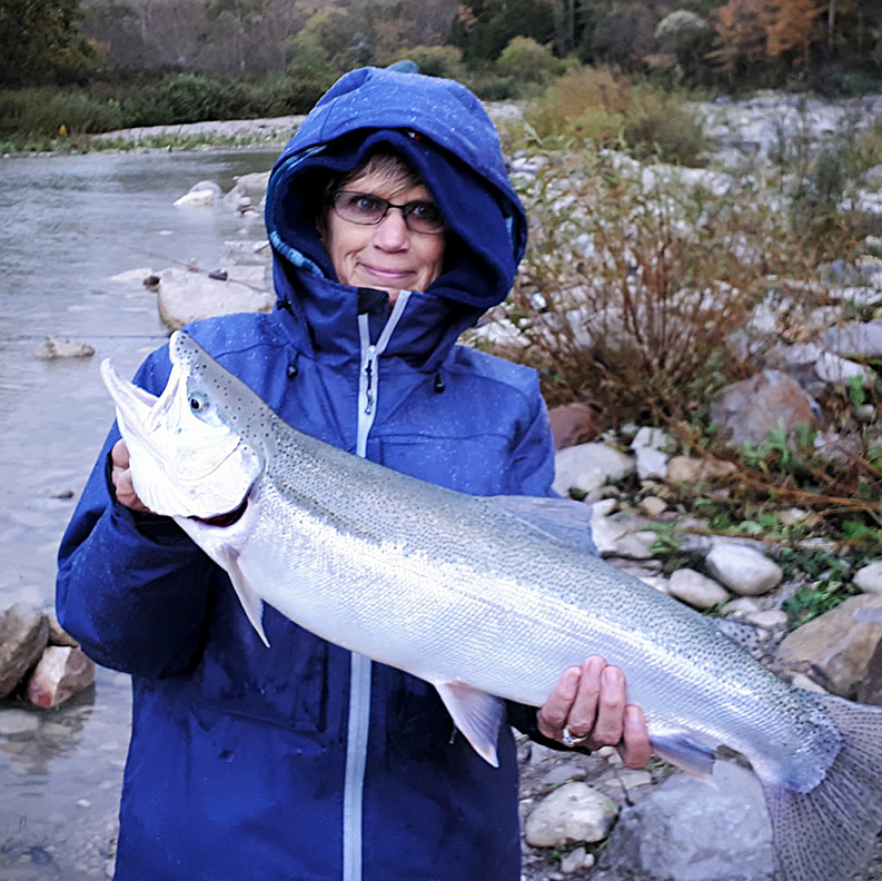 Woman Holding a Fish